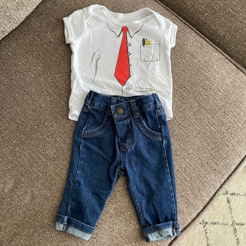 Newborn onesie and jeans outfit.